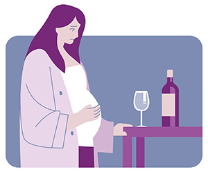 pregnant woman looking at wine glass and wine bottle